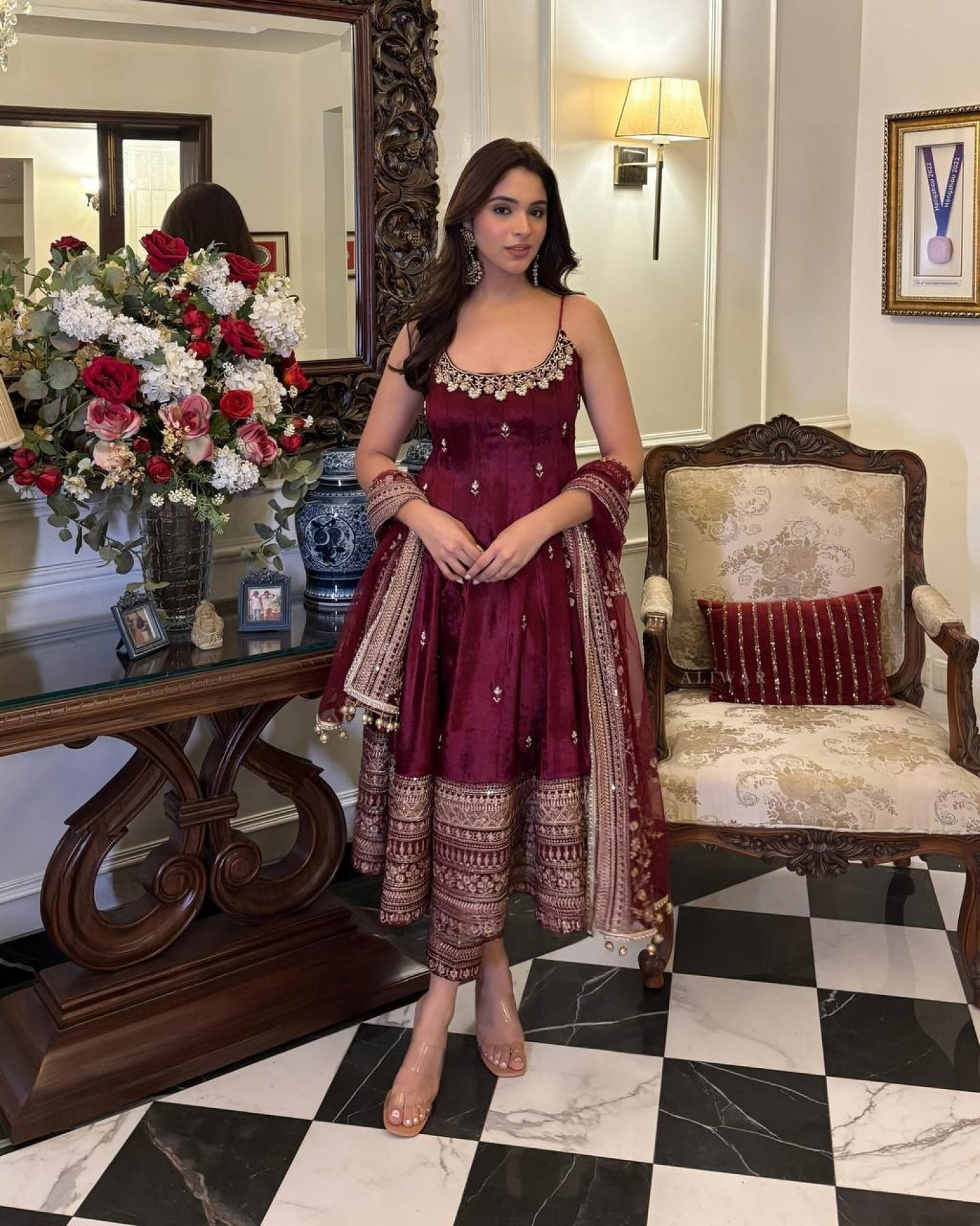 Women wearing Aarohi Maroon Anarkali Suit Set with Zari_SequinsWork from lahariya in her house