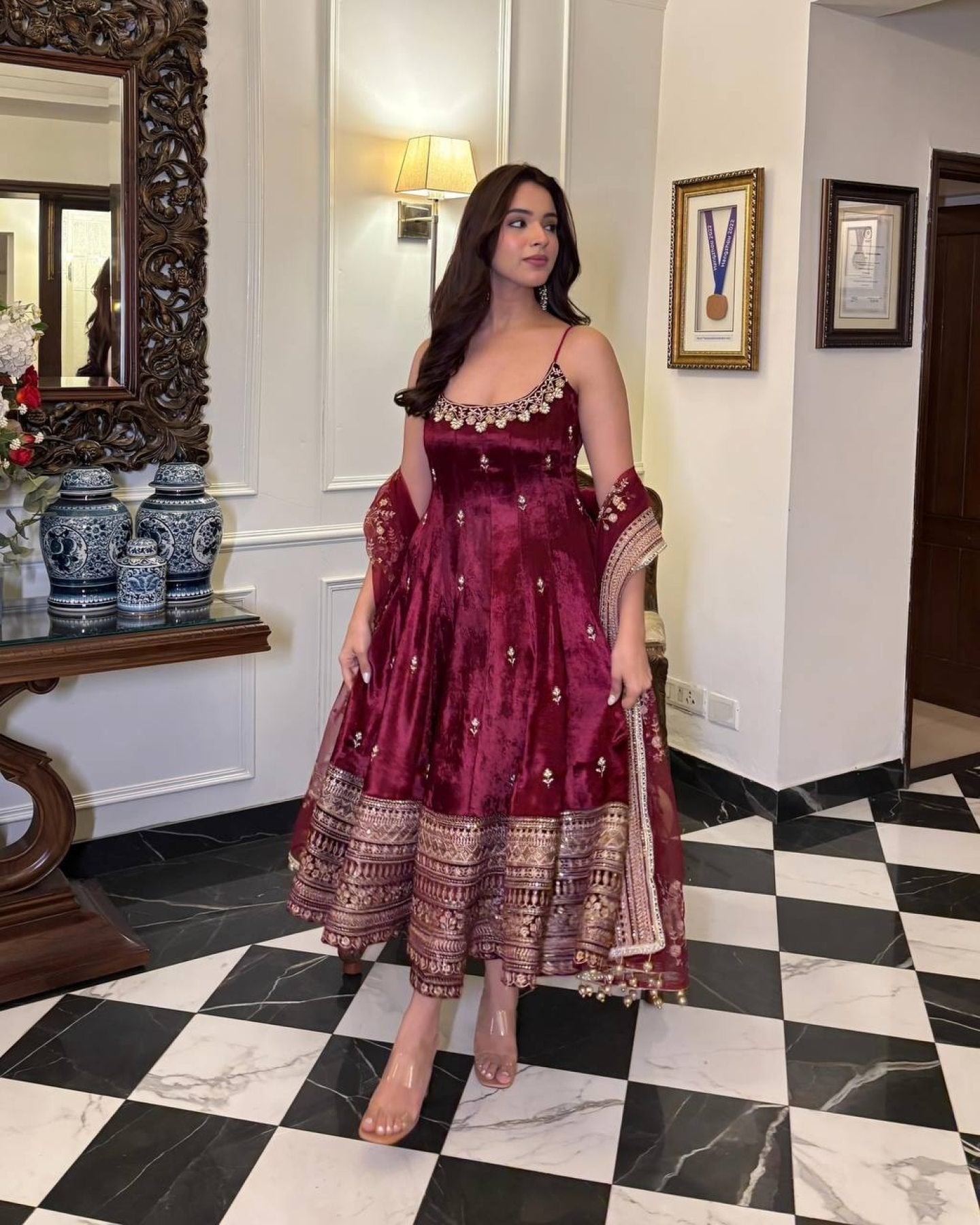 Women wearing Aarohi Maroon Anarkali Suit Set with Zari_SequinsWork from lahariya in her house