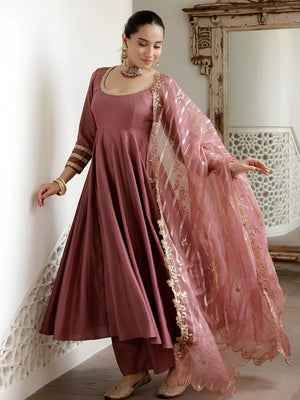 women wearing Ira Roman Silk Anarkali Palazzo Suit with Banarasi Dupatta in her house