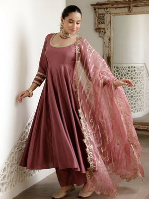 women wearing Ira Roman Silk Anarkali Palazzo Suit with Banarasi Dupatta in her house
