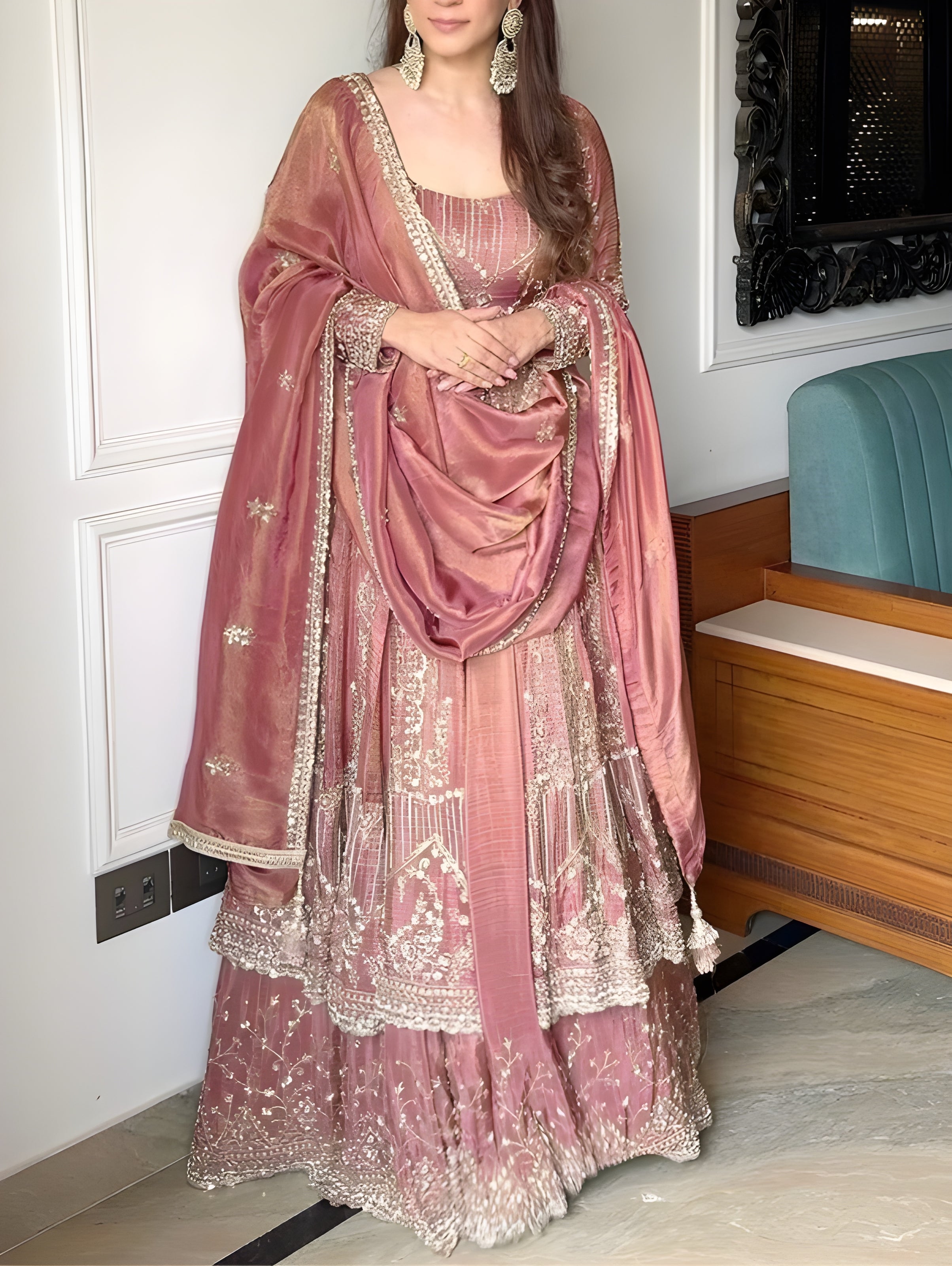 Woman in a traditional pink embroidered Sanaya Royal Pink Silk Suit with Sequin Embroider-outfit standing indoors Lahariya.com