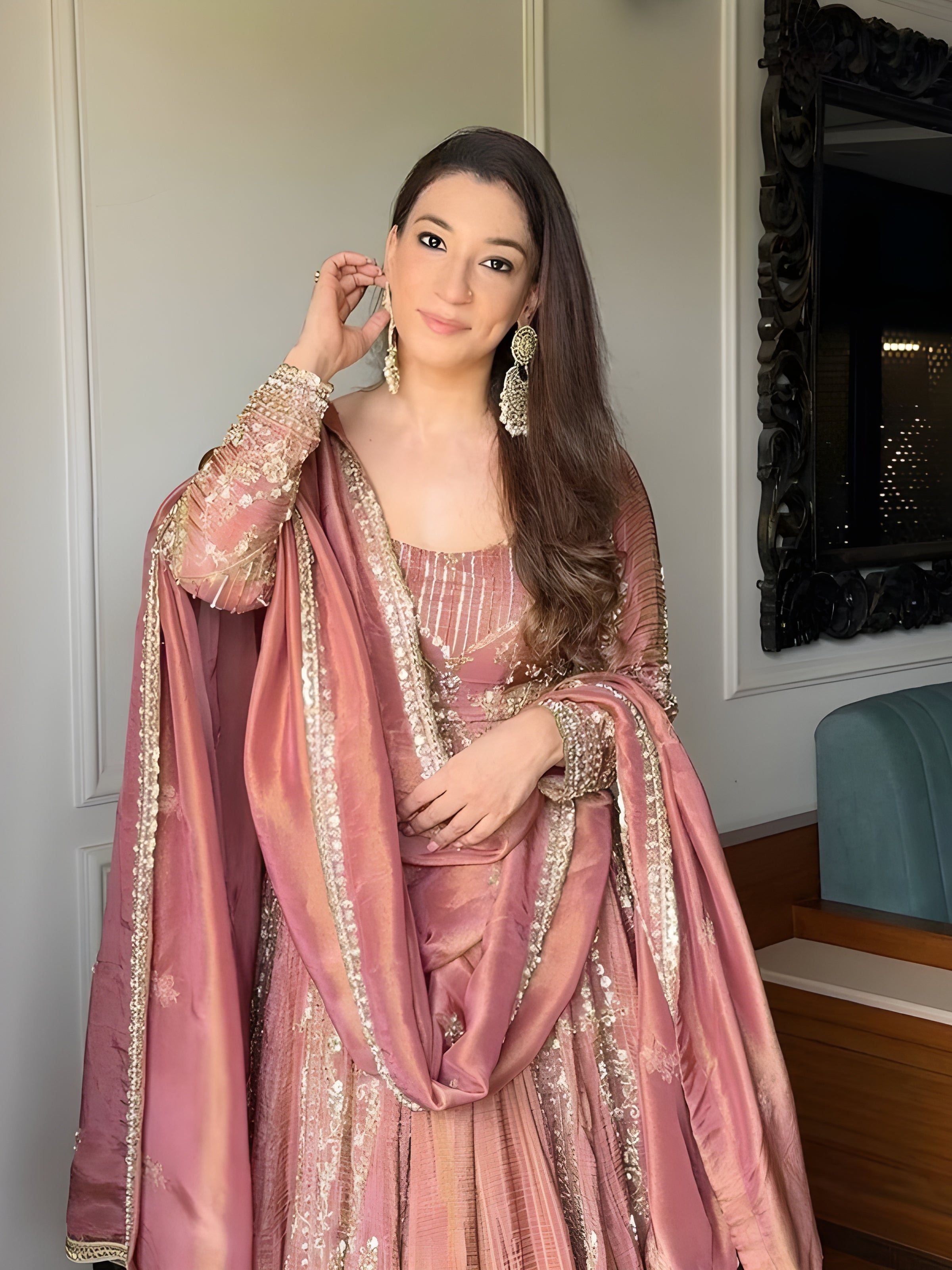 Woman in a traditional pink embroidered Sanaya Royal Pink Silk Suit with Sequin Embroider-outfit standing indoors Lahariya.com