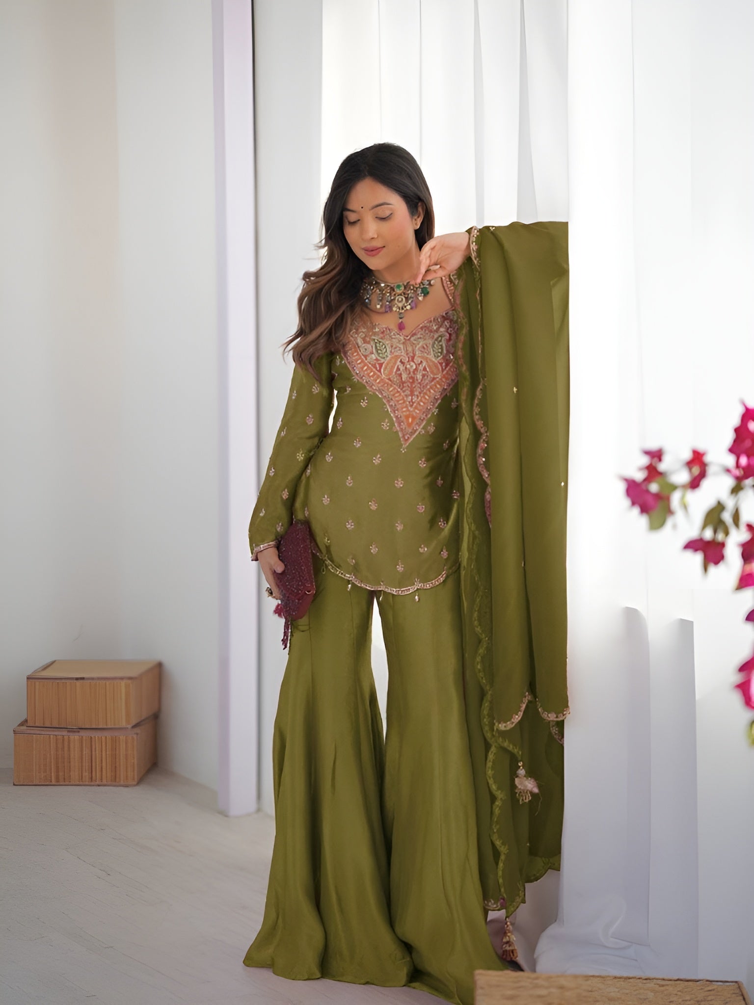 Girl Wearing Olive green Ananya Shimmer Silk Palazzo Suit with Embroidery and Dupatta in her house