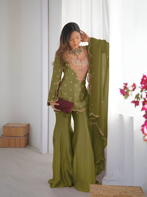 Girl Wearing Olive green Ananya Shimmer Silk Palazzo Suit with Embroidery and Dupatta in her house