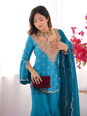 Girl Wearing turquoise-blue- Ananya Shimmer Silk Palazzo Suit with Embroidery and Dupatta in her house
