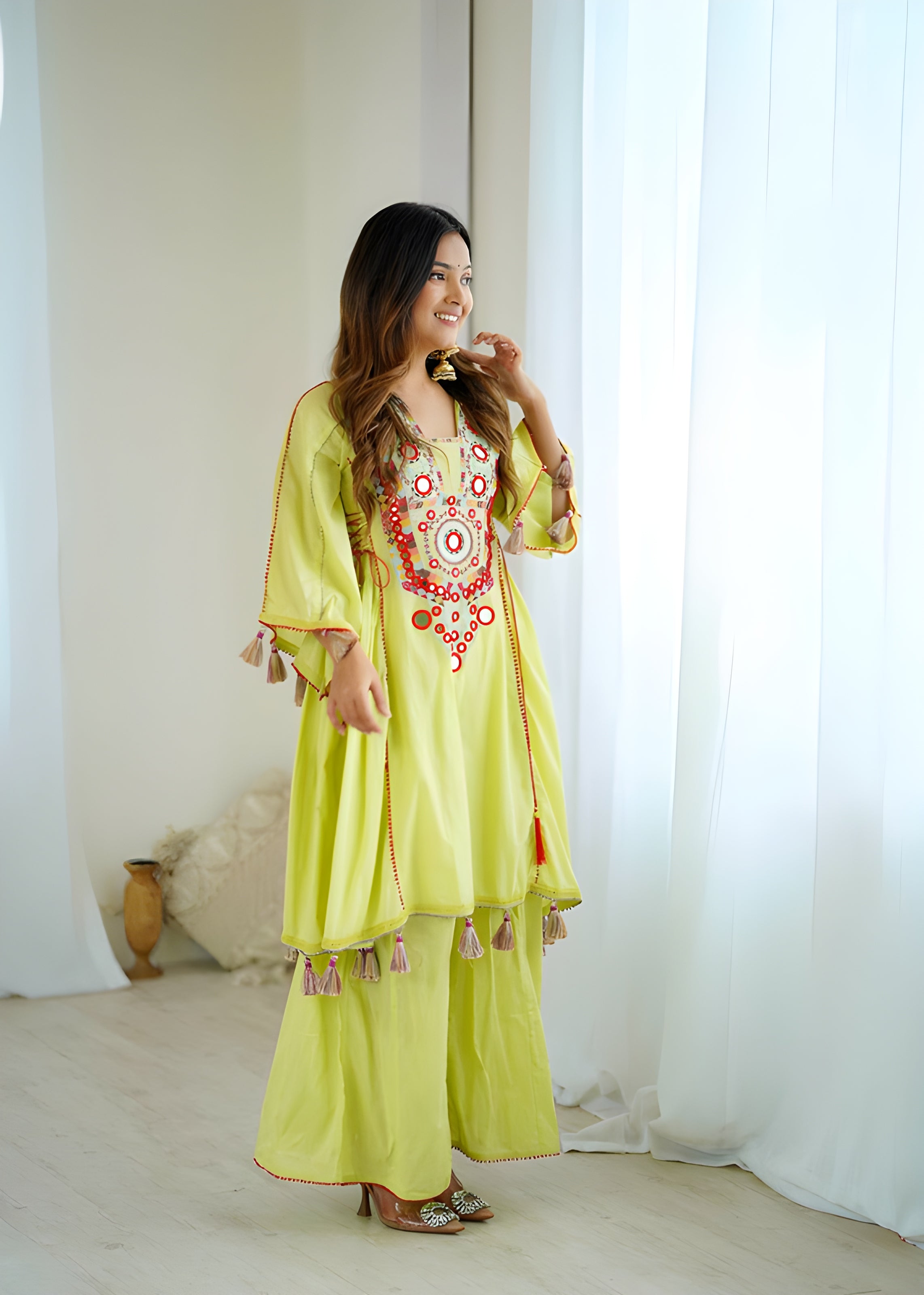 women wearing Jhanvi Tassel Mirror Work Kurta & Palazzo Set - Lahariya.com