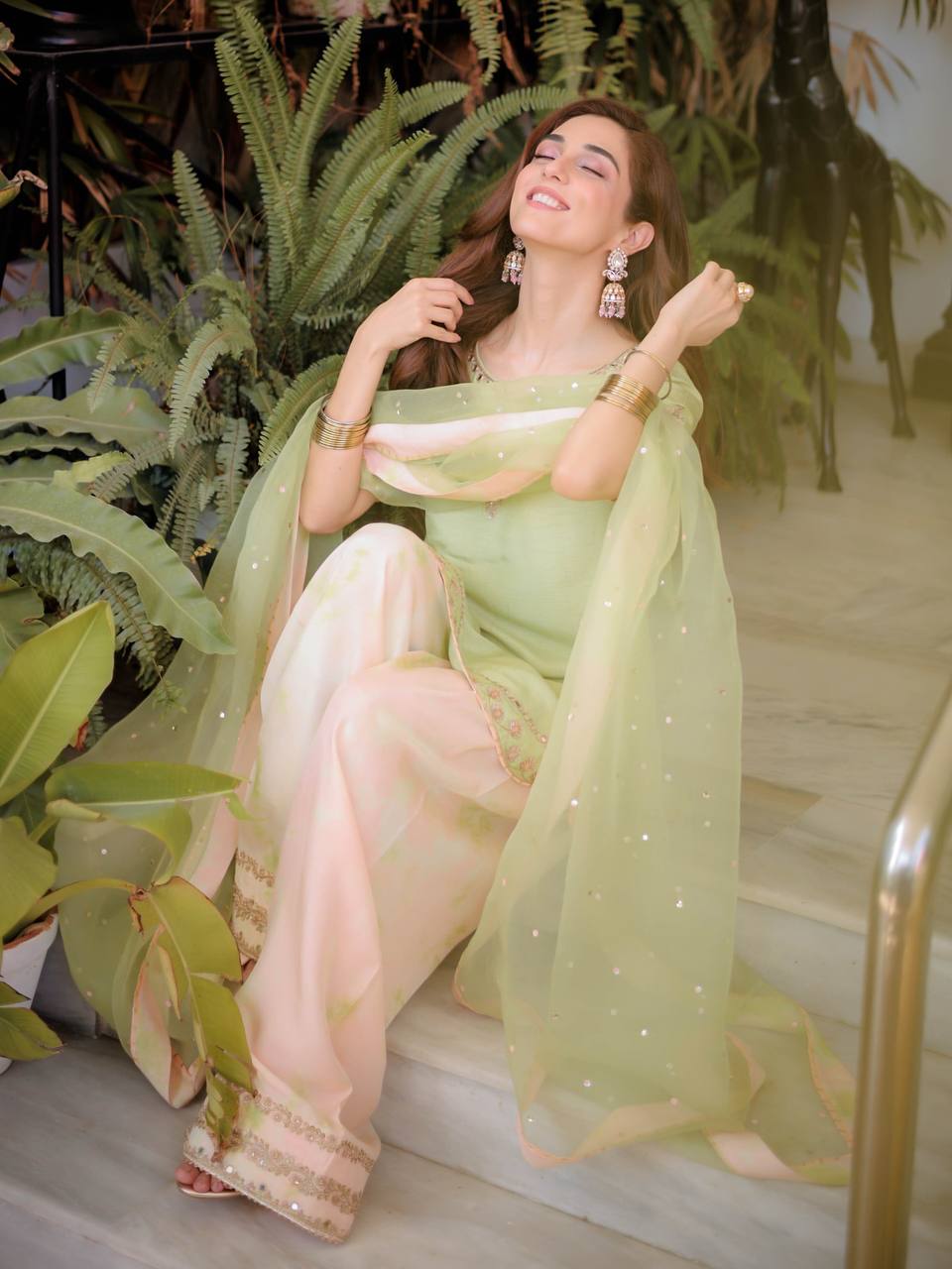 Woman in a Meher Mirror Work Embroidered Palazzo Suit-Lahariya.com