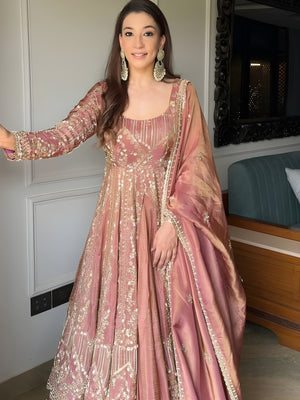 Woman in a traditional pink embroidered Sanaya Royal Pink Silk Suit with Sequin Embroider-outfit standing indoors Lahariya.com
